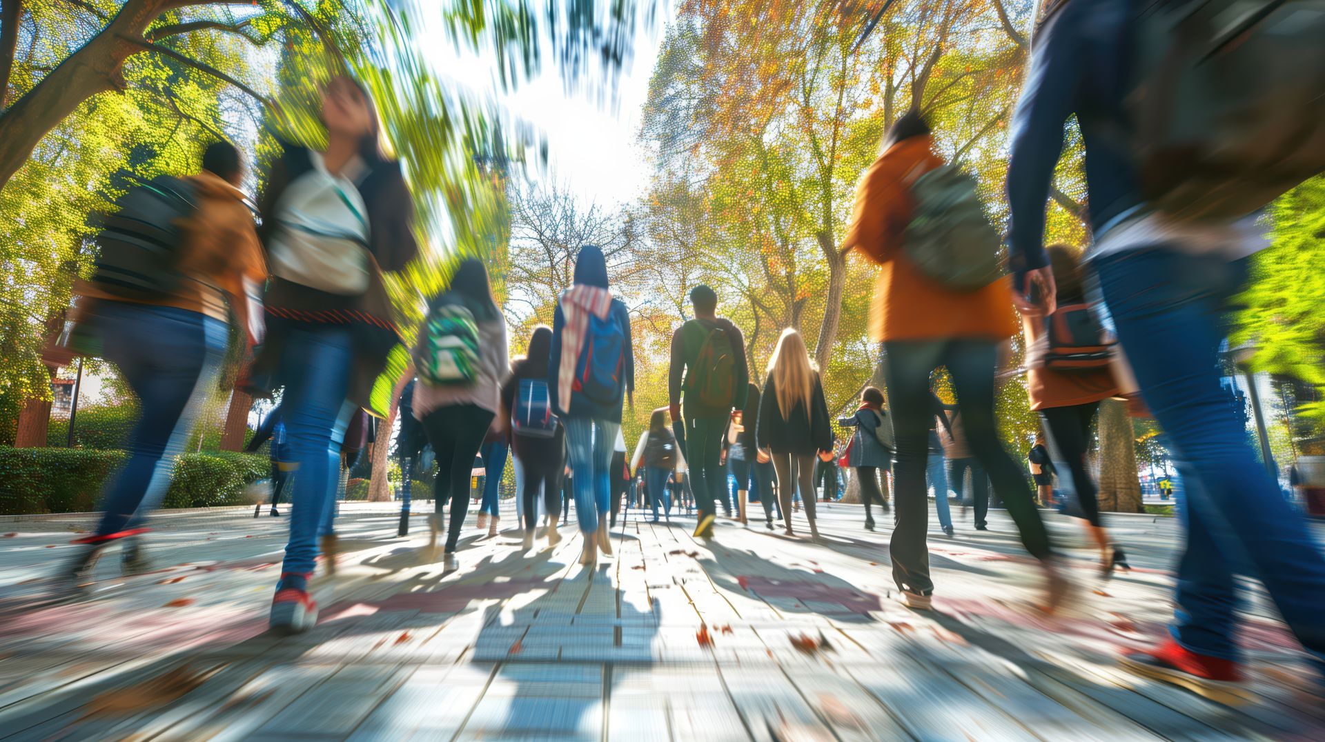 A woman with a backpack is walking down a path in front of a building.