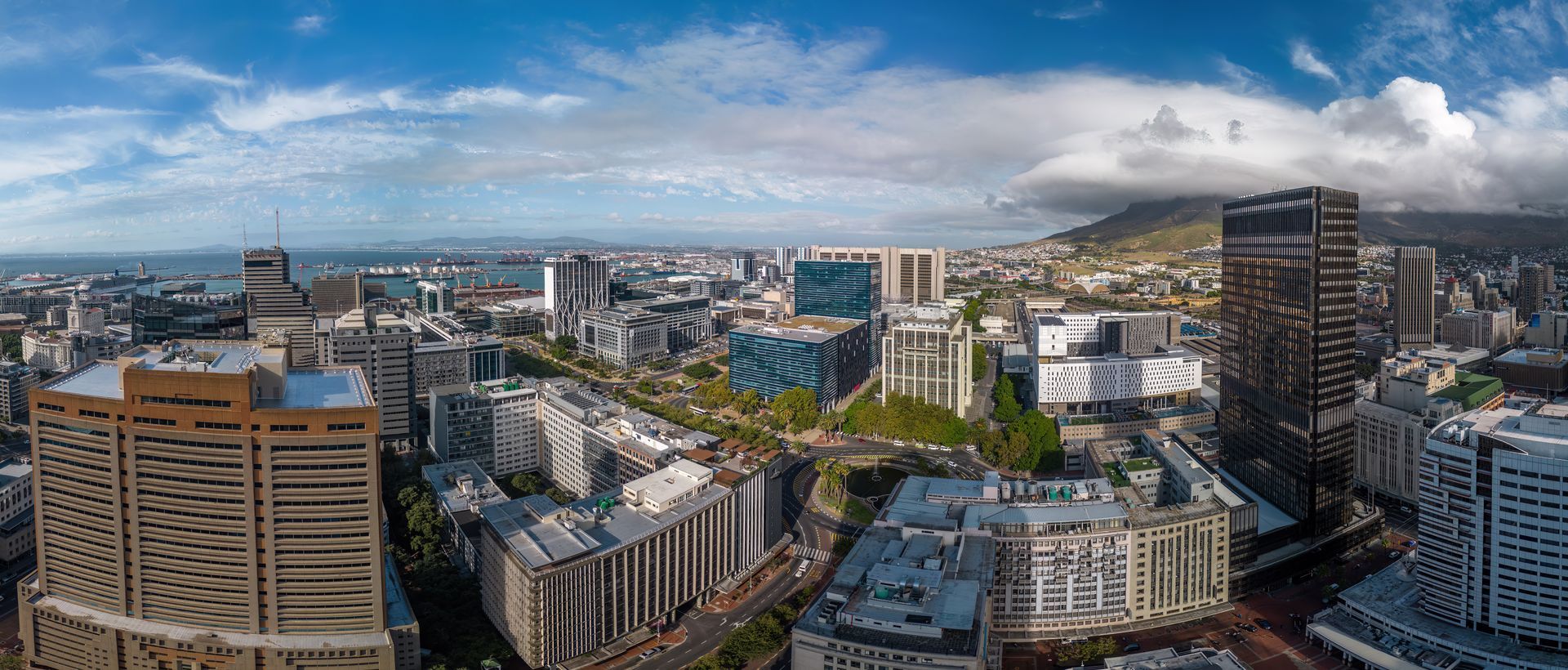 An aerial view of a city with lots of buildings and trees.