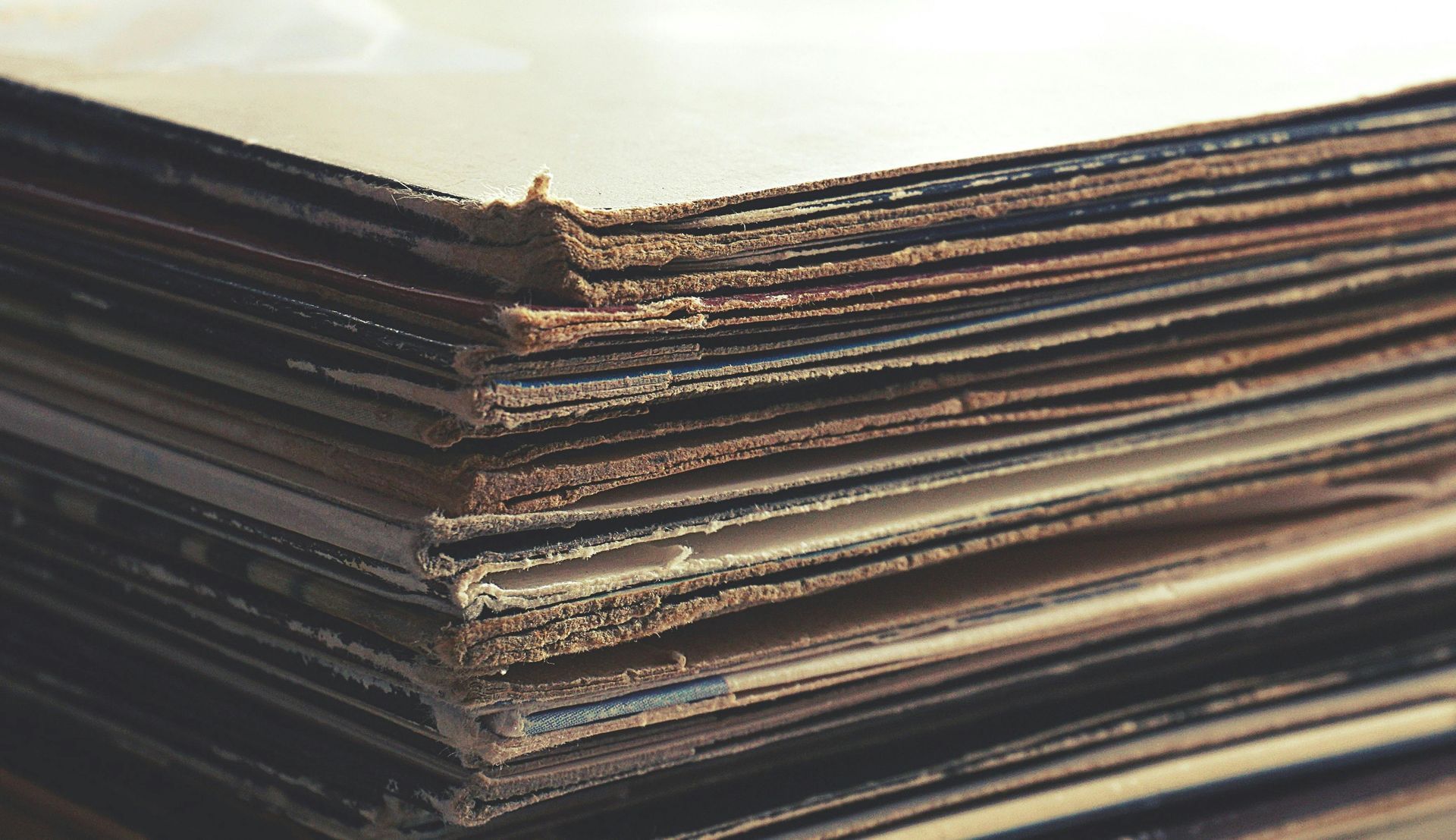A close-up of a stack of cardboard sheets on a table Recycled