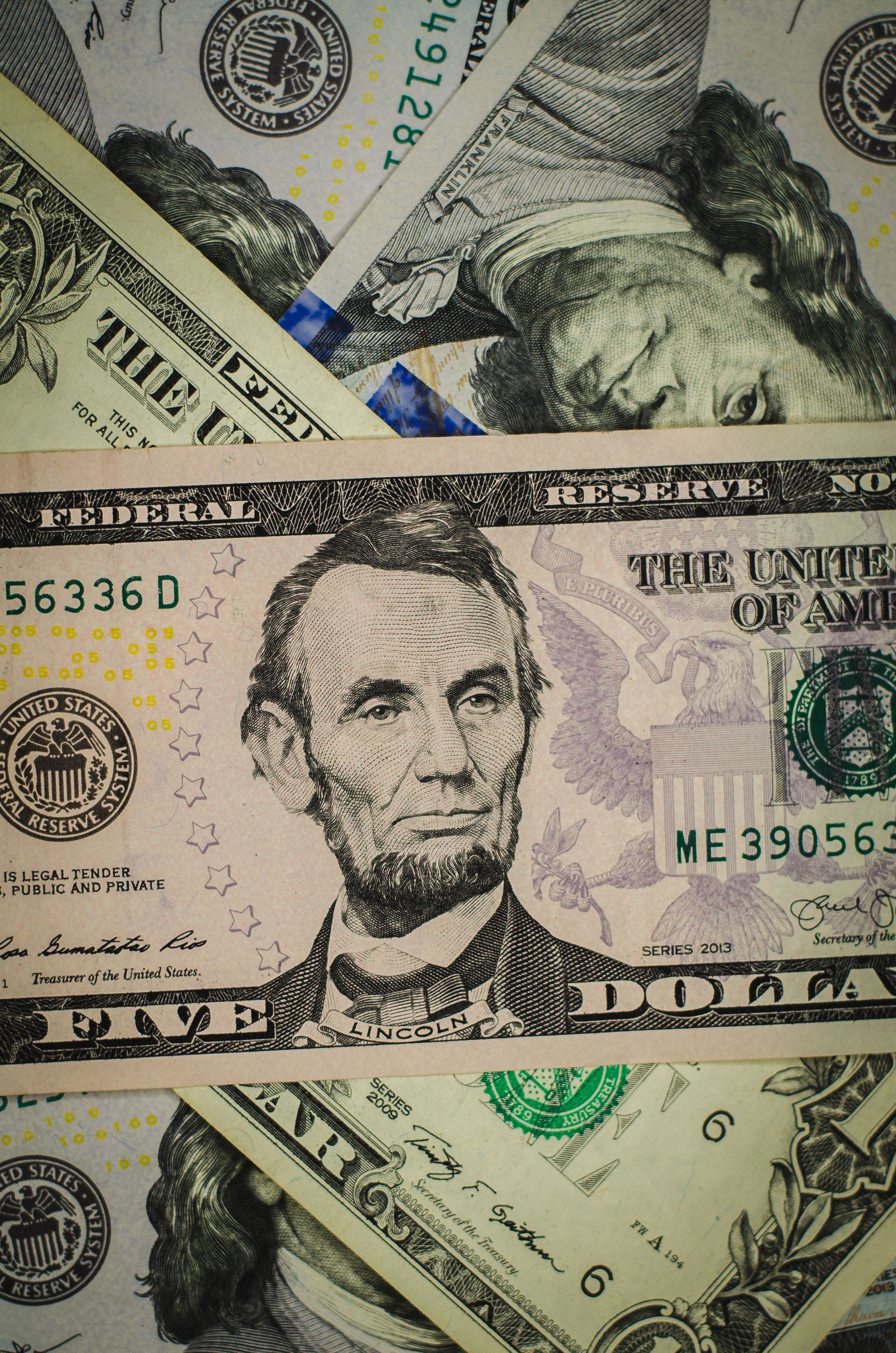 A close up of a 20 dollar bill with abraham lincoln on it