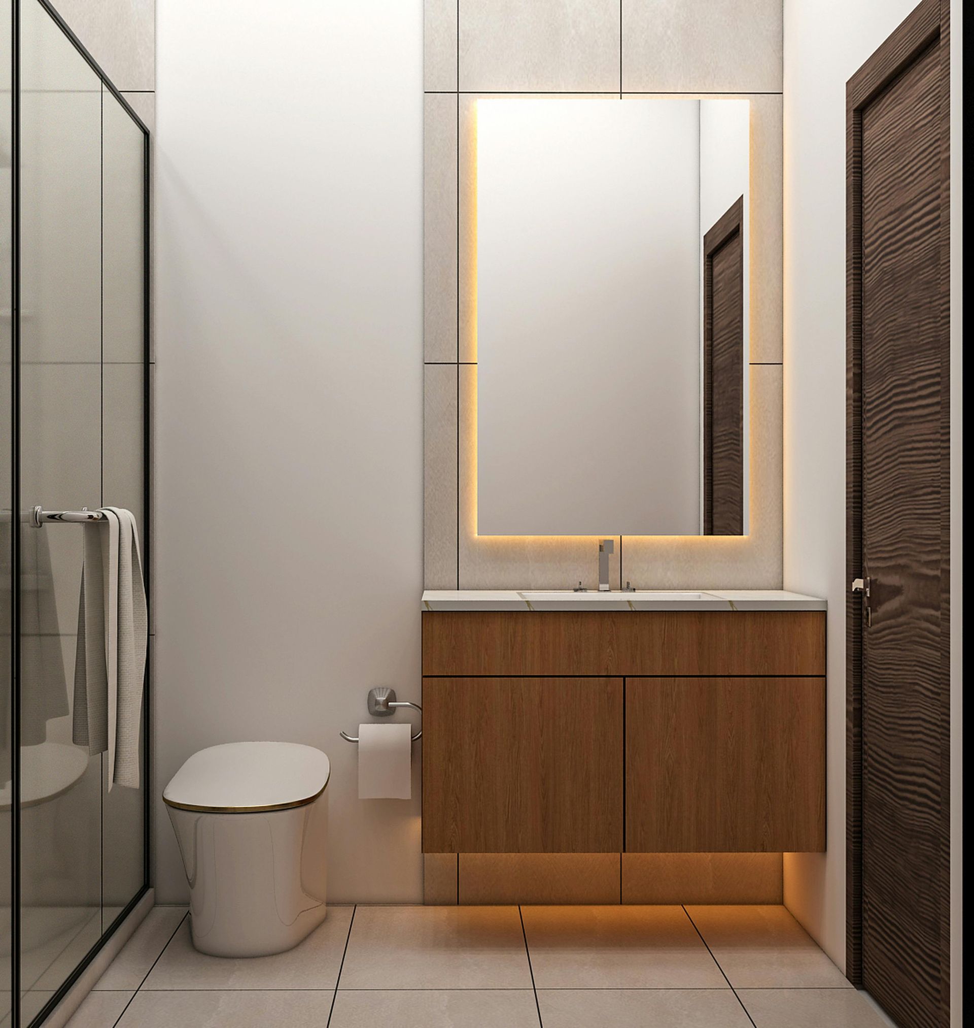 Modern bathroom with glass shower, toilet, and wood vanity with lit mirror and warm under-cabinet lighting
