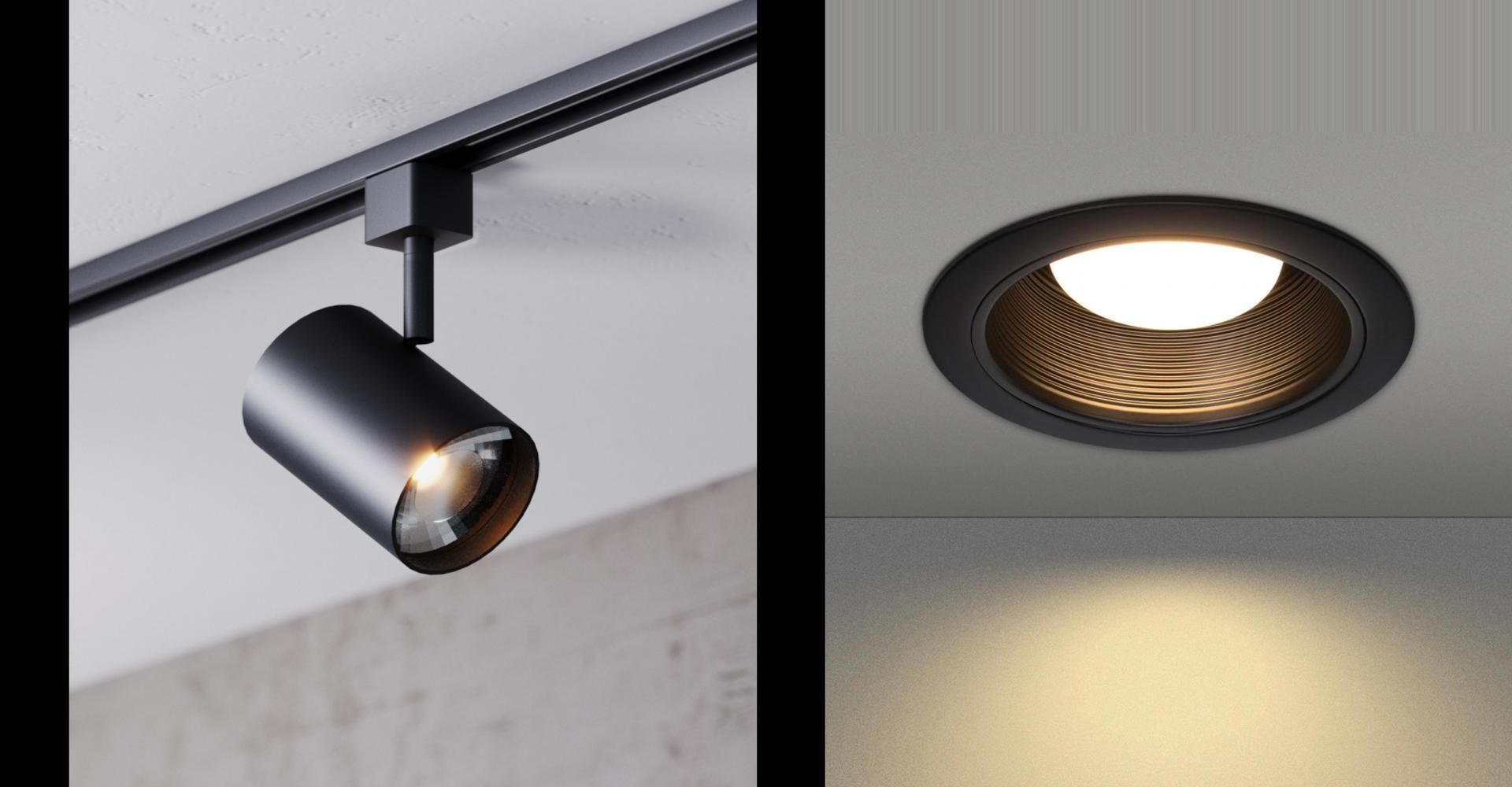 Two black recessed ceiling spotlights casting warm light on a wall and floor