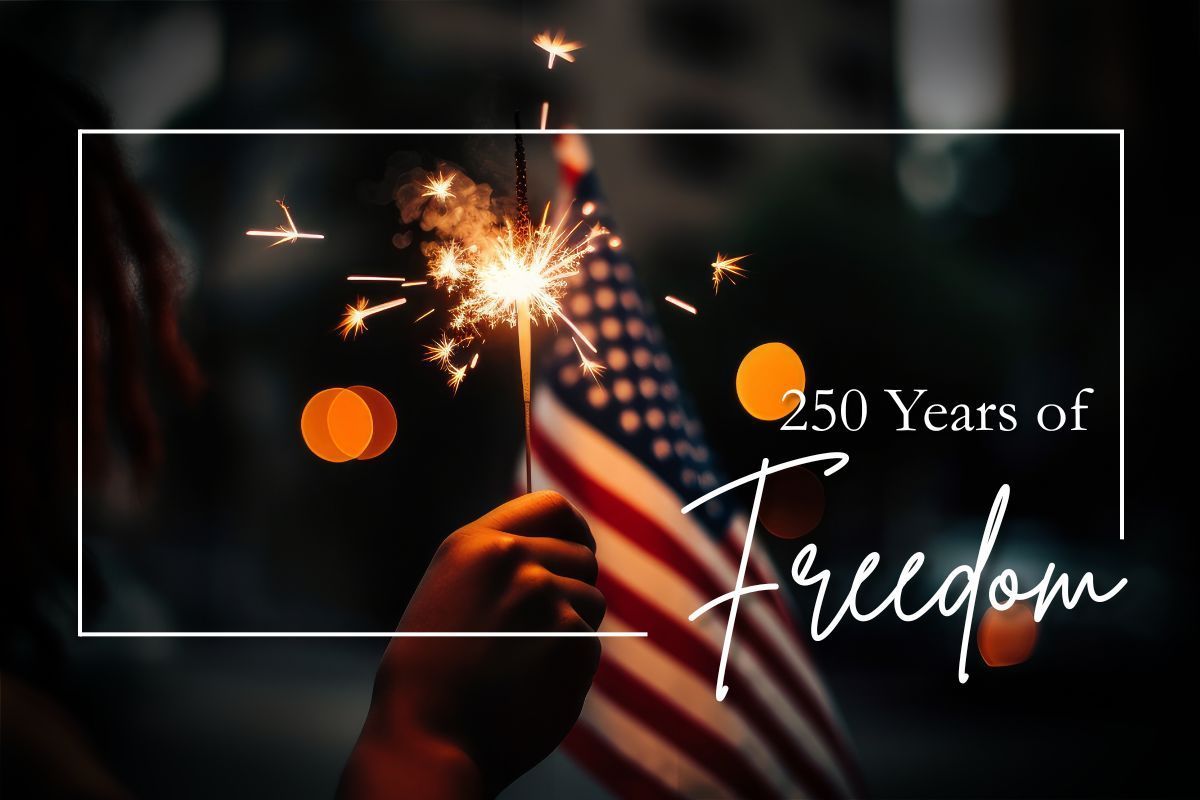 American flag with fireworks and text “250 Years of Freedom” on a dark background
