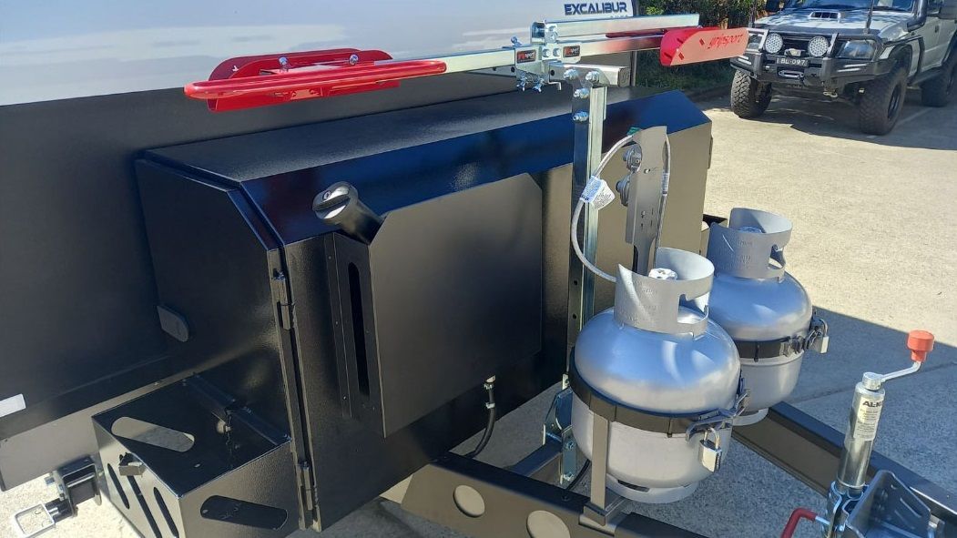 Two Propane Tanks Are Attached To The Back Of A Truck — Lake Macquarie Caravan Repairs In Gosford, NSW