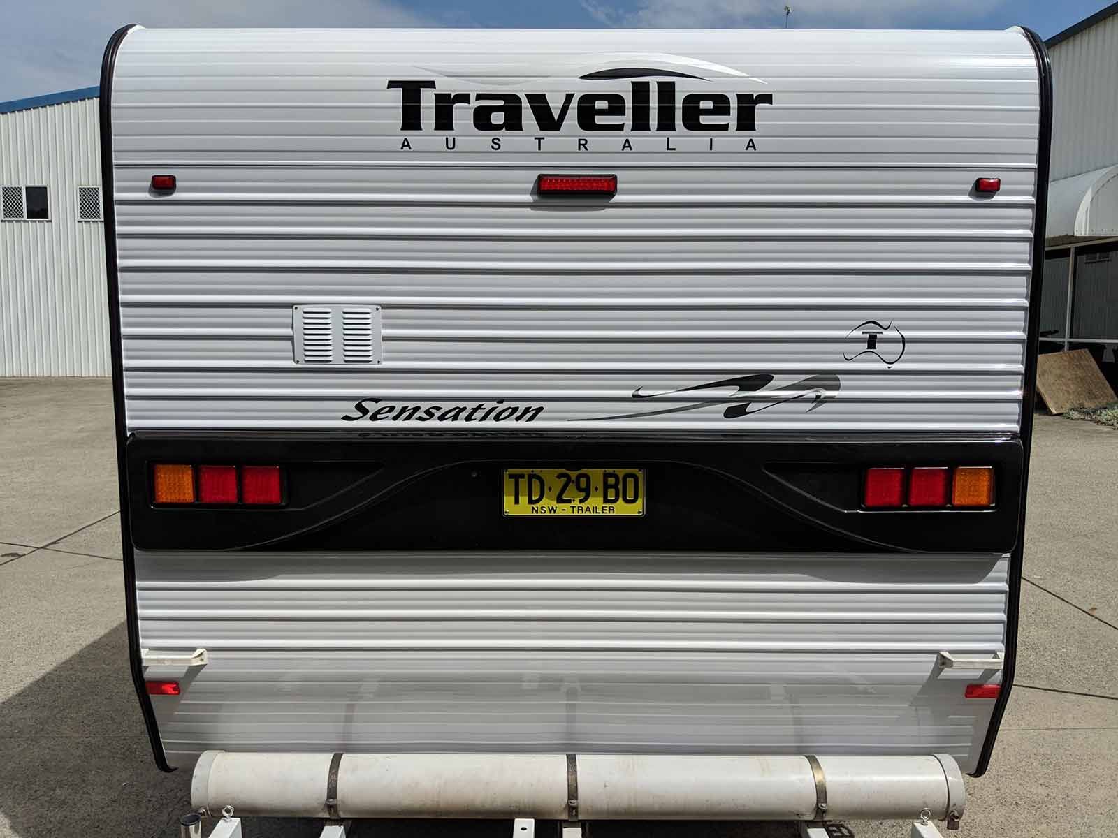 A Caravan Is Parked In A Parking Lot — Lake Macquarie Caravan Repairs In Cardiff, NSW