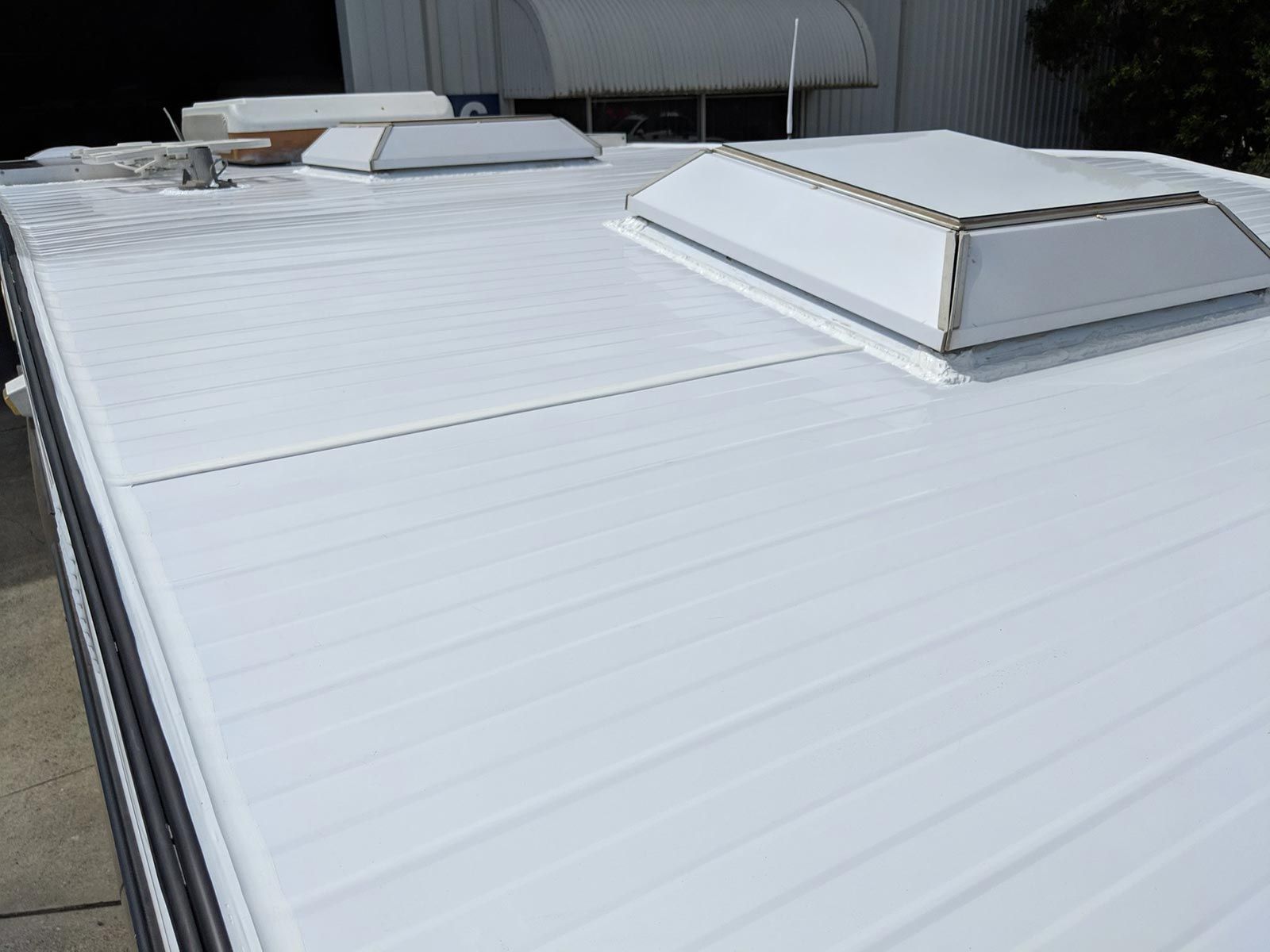 A White Roof With Two Skylights On Top Of It — Lake Macquarie Caravan Repairs In Cardiff, NSW