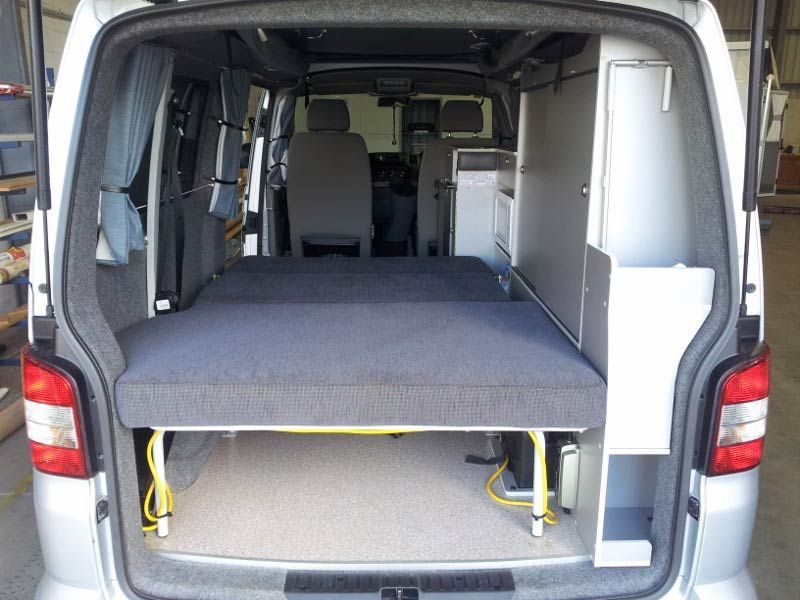 The Back Of A Van With A Bed In It — Lake Macquarie Caravan Repairs In Cardiff, NSW
