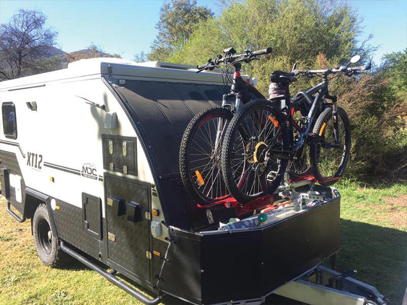 Two Bicycles Are Attached To The Back Of A Trailer — Lake Macquarie Caravan Repairs In Cardiff, NSW