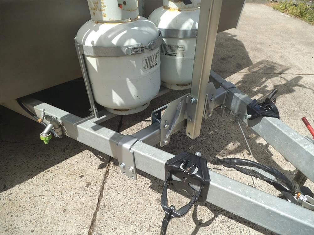 A Trailer With Two Propane Tanks Attached To It — Lake Macquarie Caravan Repairs In Cardiff, NSW