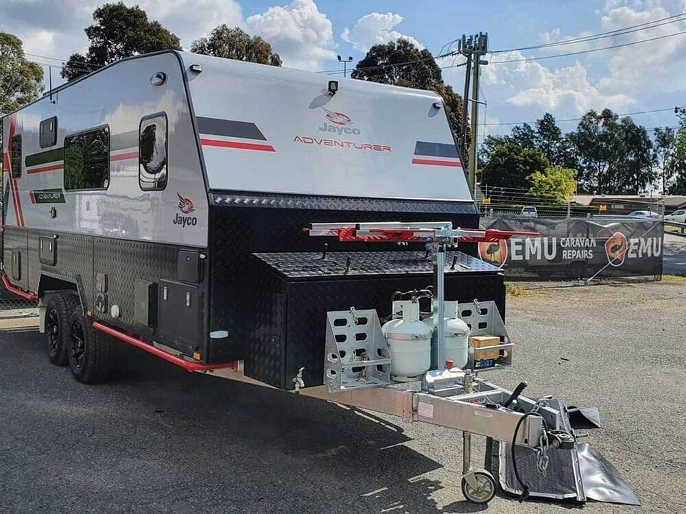 A Camper Trailer Is Parked In A Parking Lot — Lake Macquarie Caravan Repairs In Cardiff, NSW