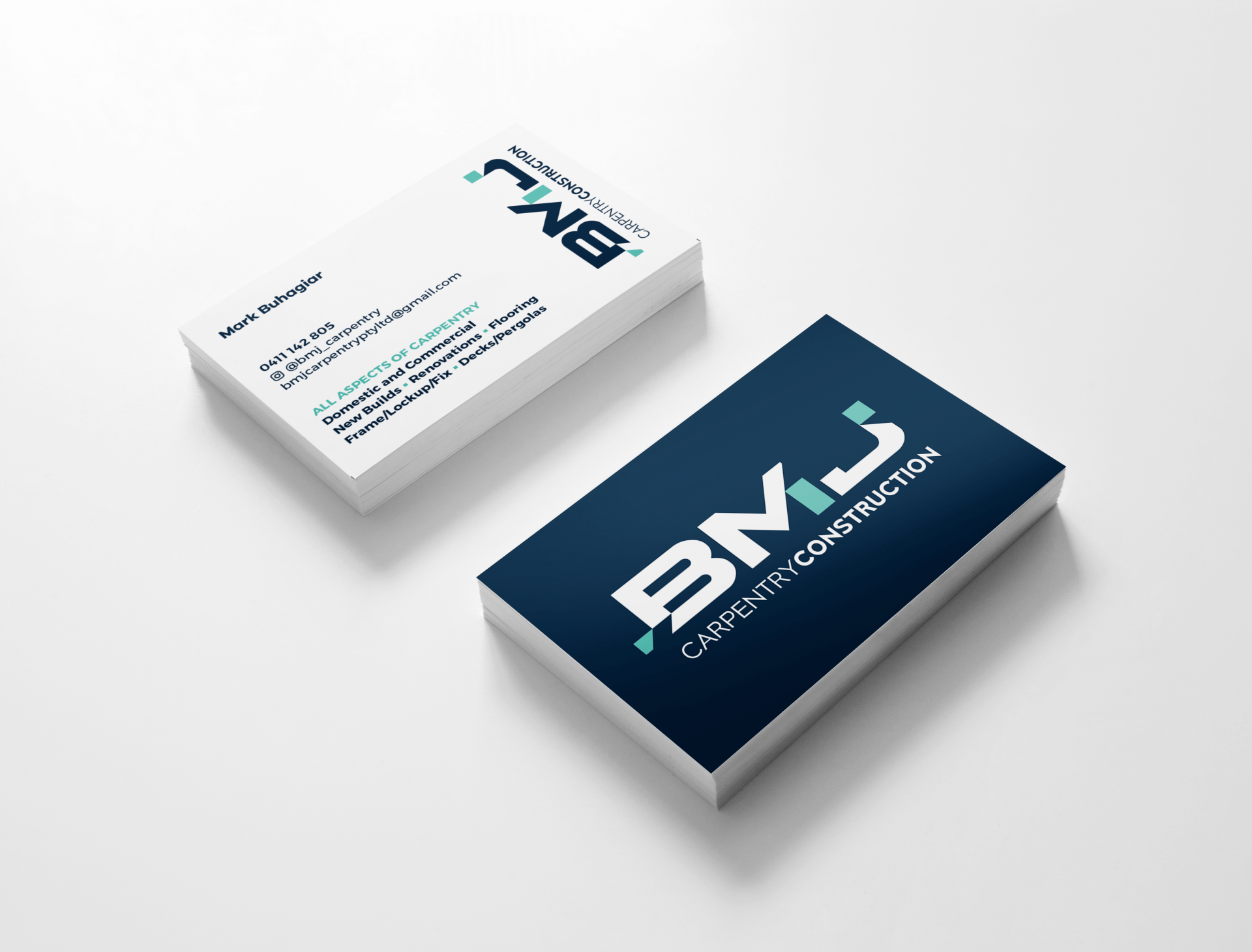 Two BMJ-branded business cards, one navy and one white, shown on a light background.