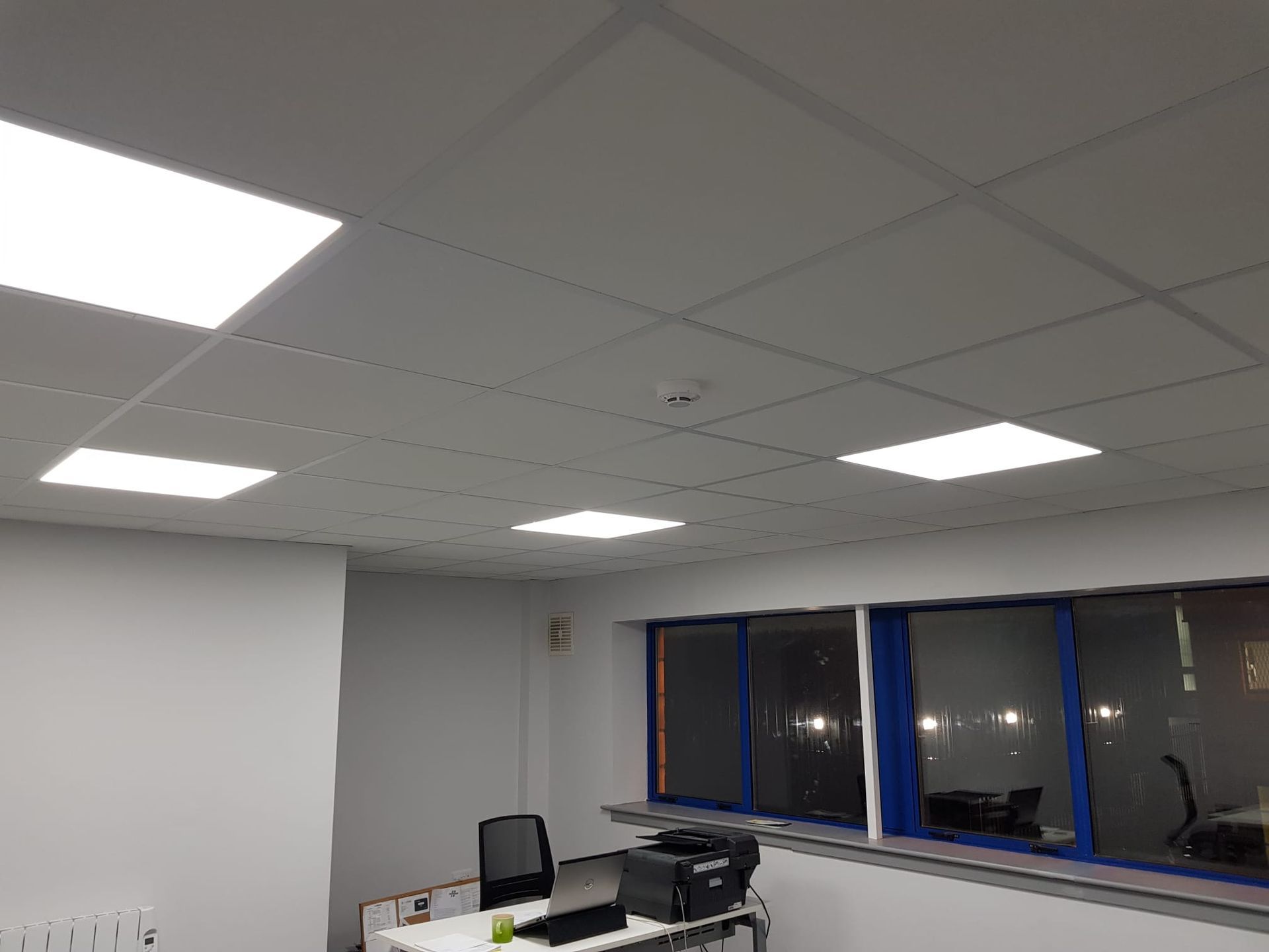 A room with a ceiling that has a lot of lights on it.