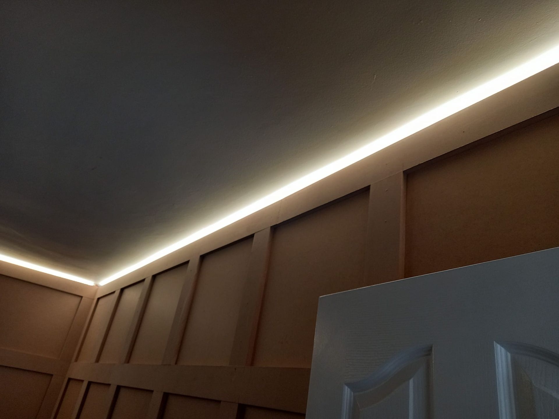 A room with a ceiling that has a light on it