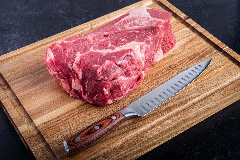 Raw Meat with a chef knife