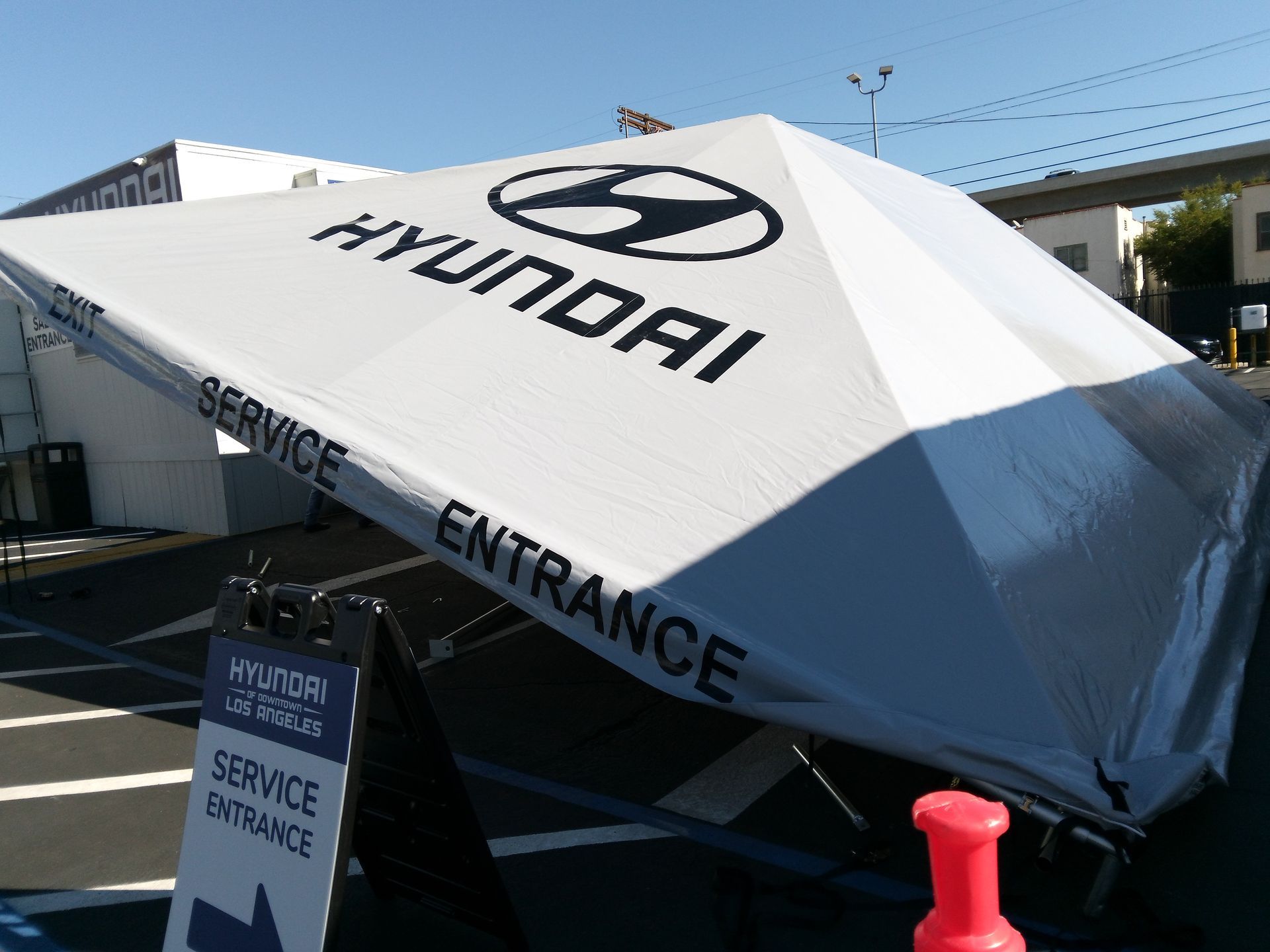 Hyundai service entrance tent with large logo and black lettering