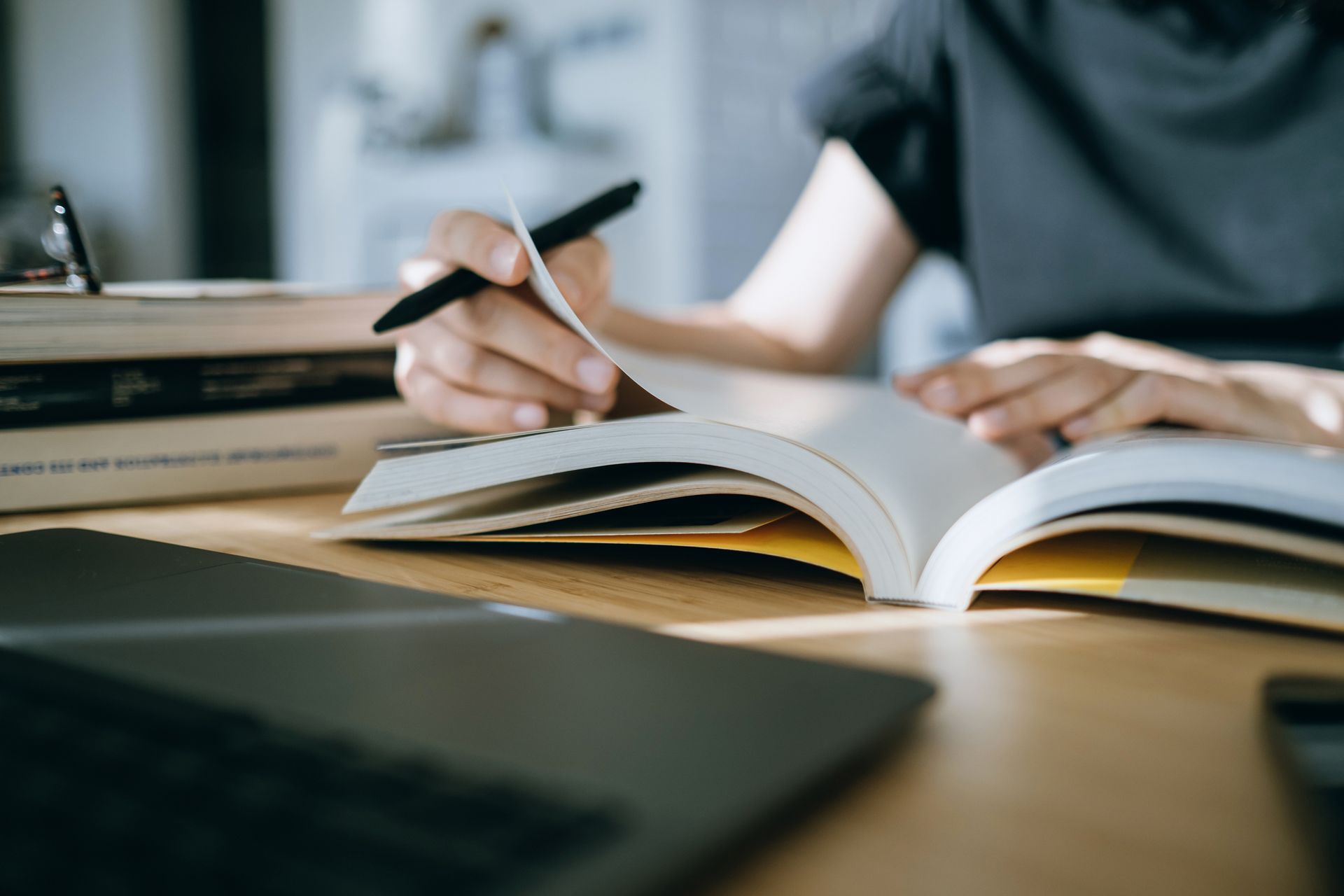 Woman Reading a Book — Campbelltown, NSW — Gorman Jones Lawyers