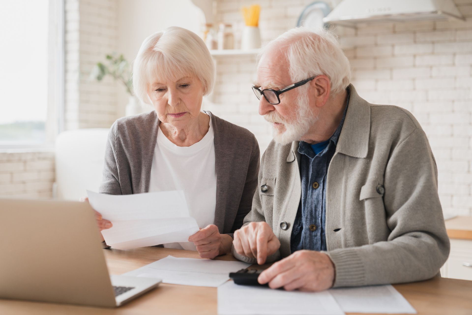 Senior Couple Counting Funds — Campbelltown, NSW — Gorman Jones Lawyers