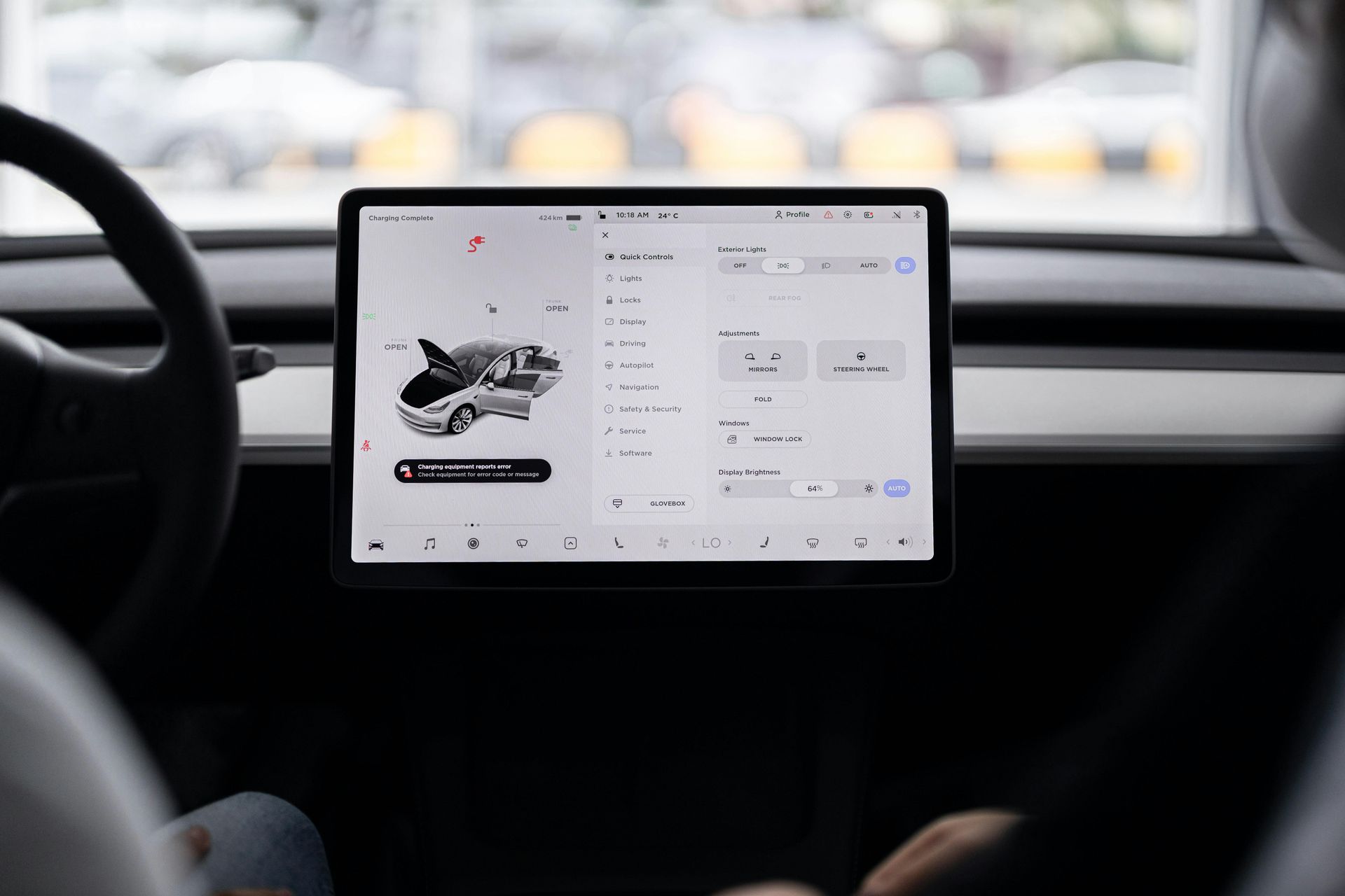 Dashboard-mounted tablet showing a product page for a white sneaker inside a car