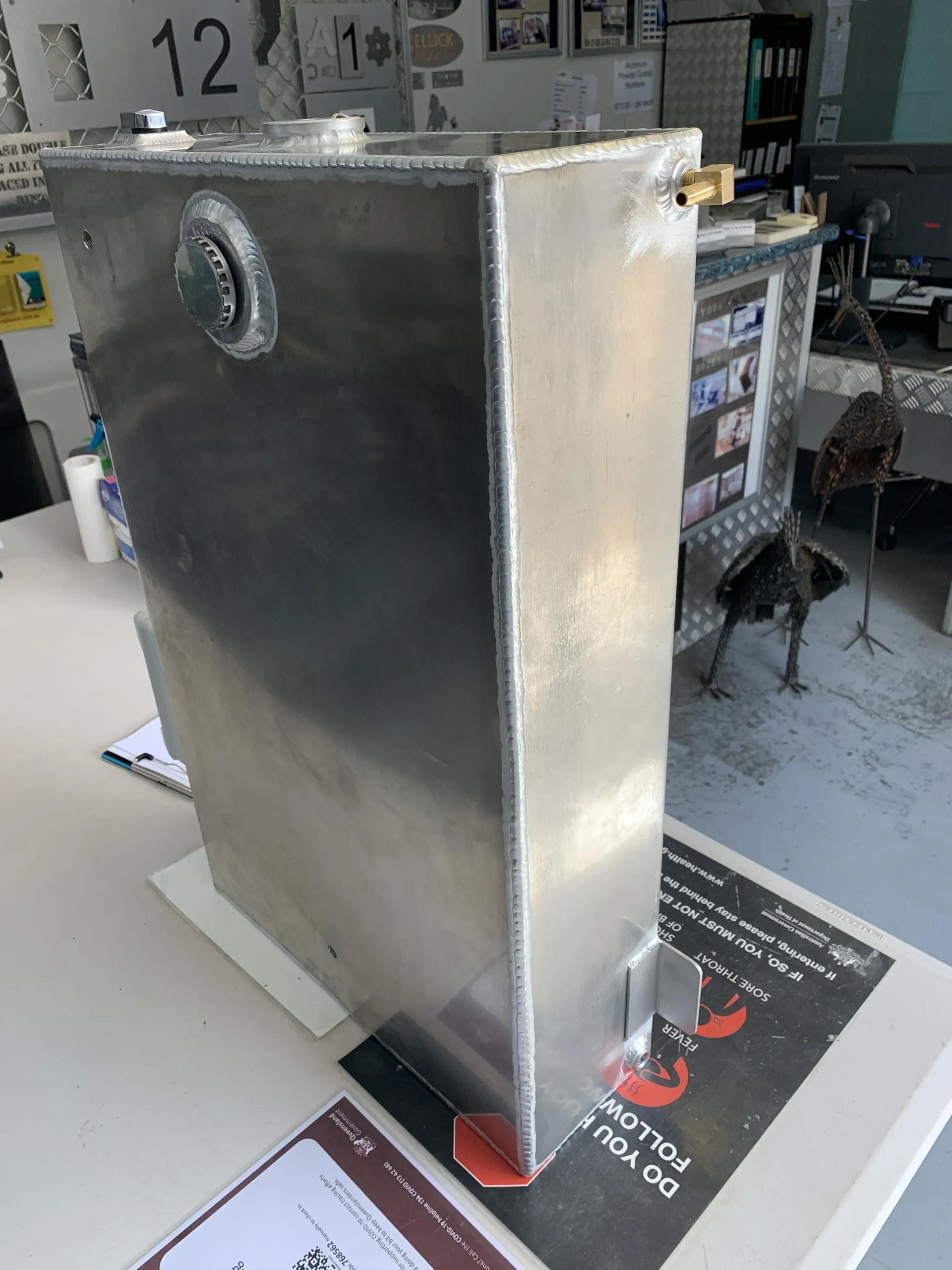 A stainless steel tank is sitting on top of a table. — Keystone Engineering Sheet Metal Industries in Noosaville, QLD