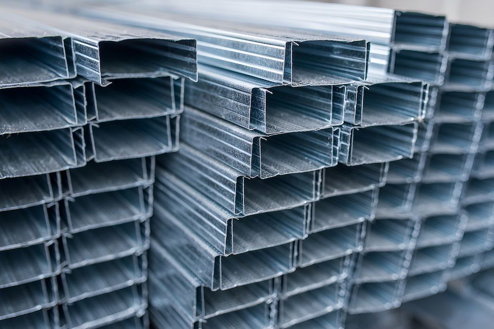 A Pile Of Metal Tubes Stacked On Top Of Each Other — Keystone Engineering Sheet Metal Industries in Noosaville, QLD