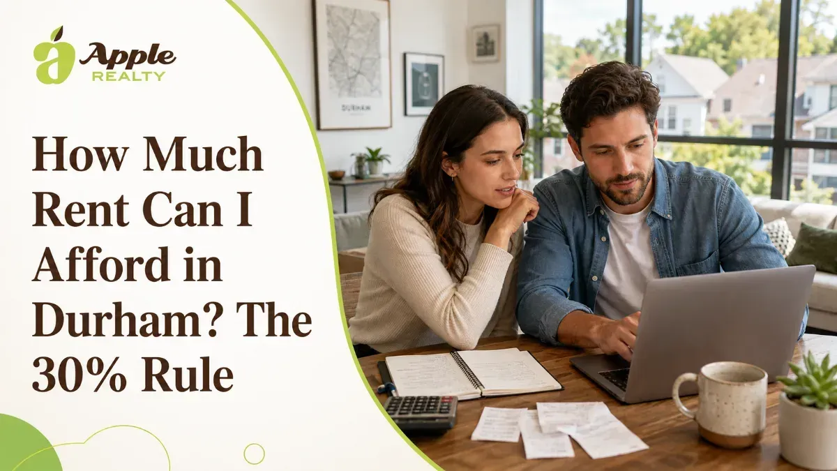 Couple reviewing rent affordability in Durham on a laptop with Apple Realty branding, discussing the