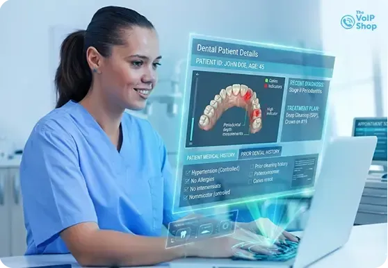 Dental Receptionist taking calls using deskphone Dental Receptionist taking calls using deskphone