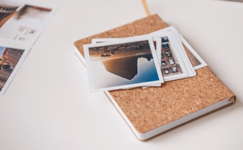 Small photo prints on an album cover, gentle memory keeping, cremation services Emmitsburg, MD