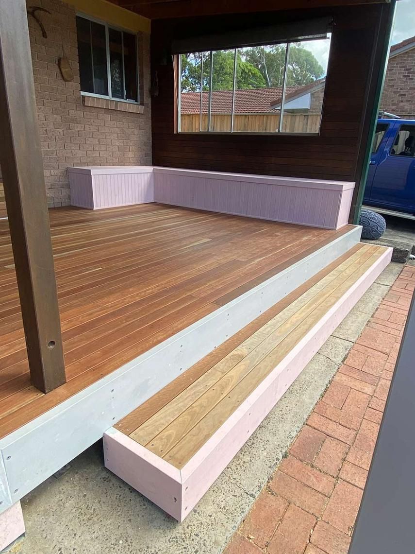 A Wooden Deck Is Being Built On The Side Of A House — B Smart Building & Design In Gerringong, NSW