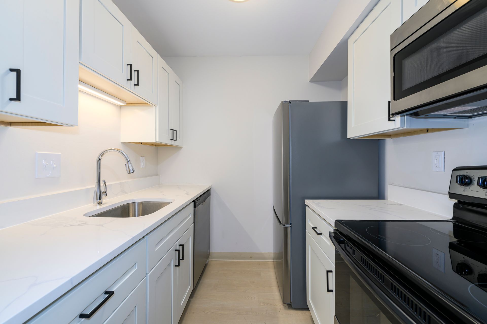 Renovated kitchen with modern appliances 