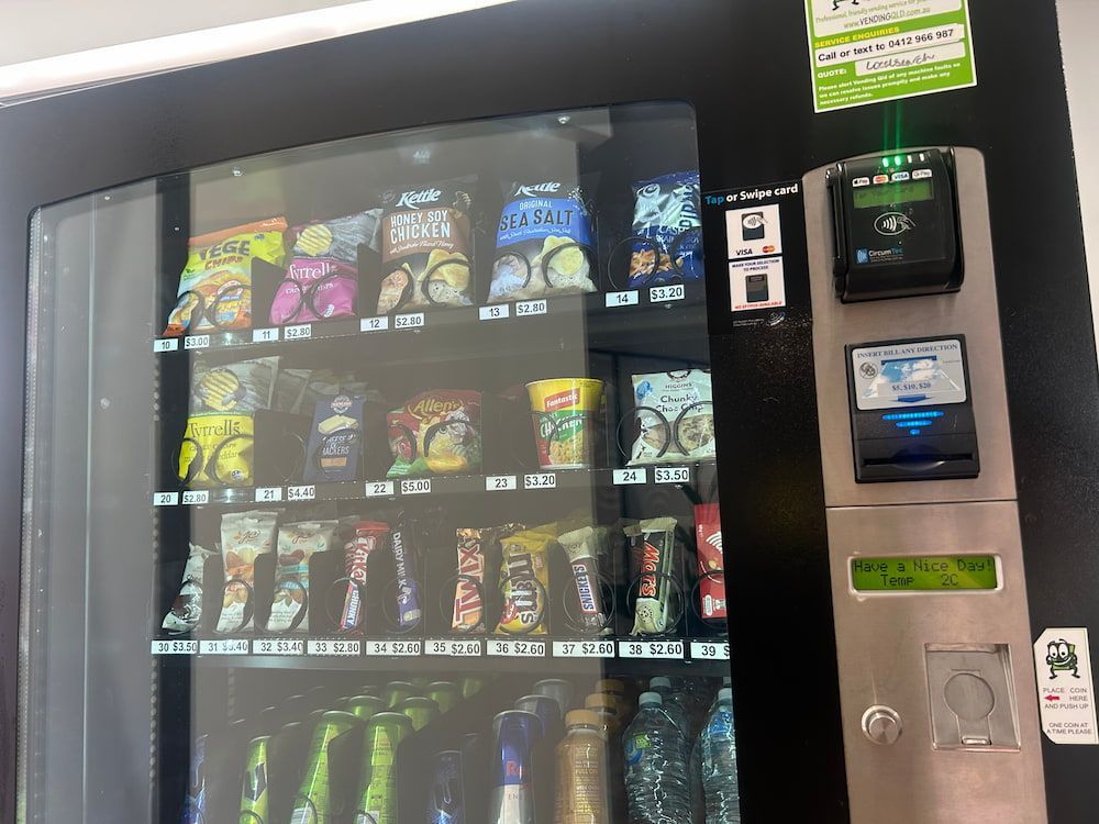 A Vending Machine Filled With a Variety of Snacks and Drinks — Central Coast Storage Solutions in Toormina, NSW