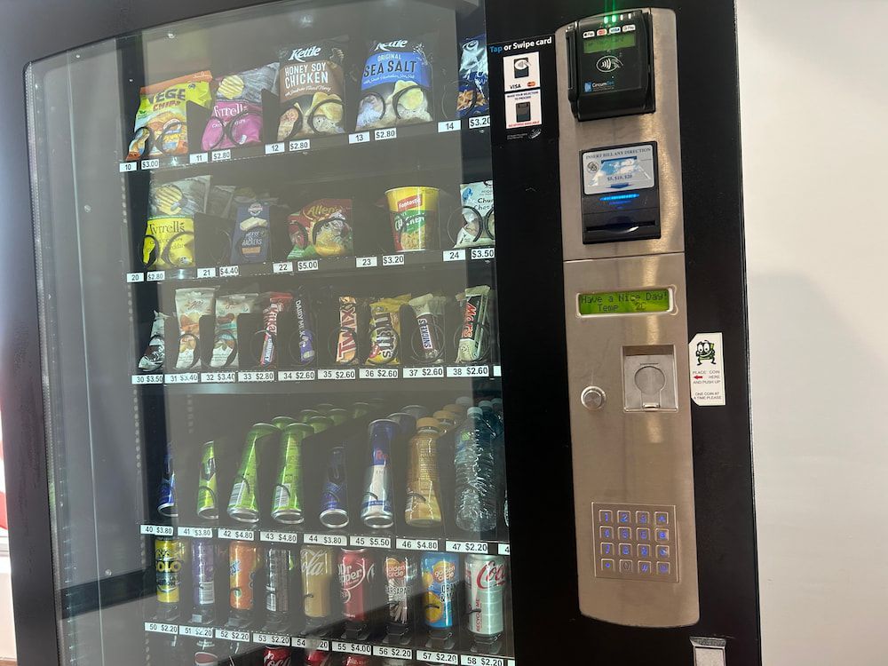 A Vending Machine Filled With a Variety of Snacks and Drinks — Central Coast Storage Solutions in Toormina, NSW