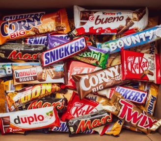 A Pile of Candy Bars Including Snickers and Twix — Central Coast Storage Solutions in Toormina, NSW