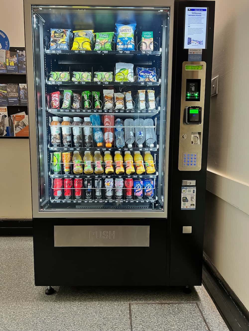 A Vending Machine Filled With Drinks and Snacks in a Hallway — Central Coast Storage Solutions in Yamba, NSW