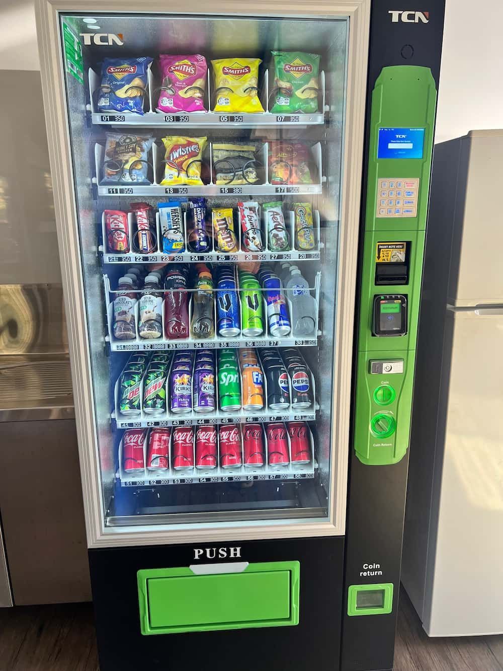 A Vending Machine Filled With a Variety of Snacks and Drinks — Central Coast Storage Solutions in Bellingen, NSW