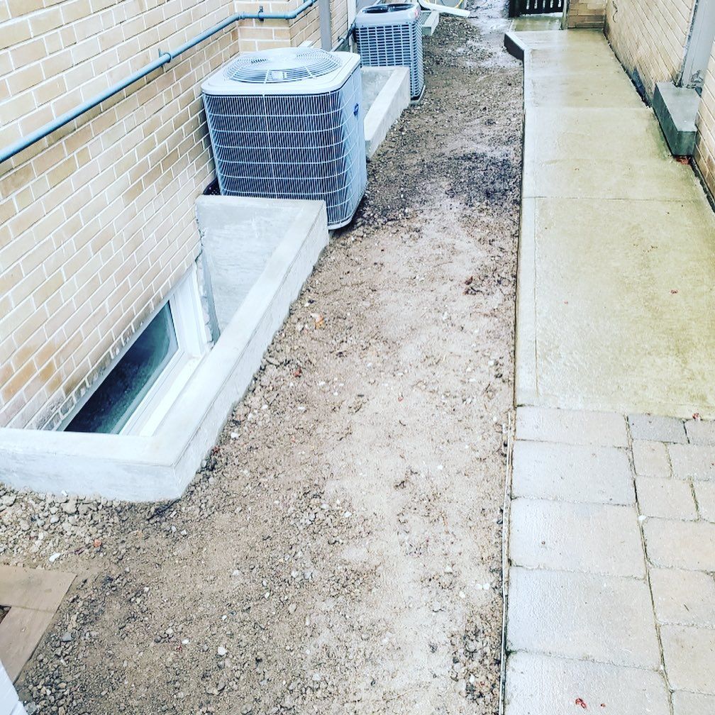 A brick building with a walkway leading to it