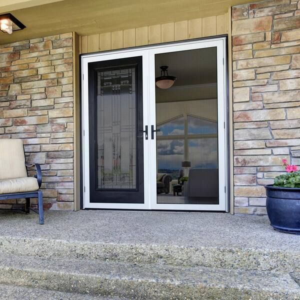 A sliding glass door with a fence around it is open to a balcony.