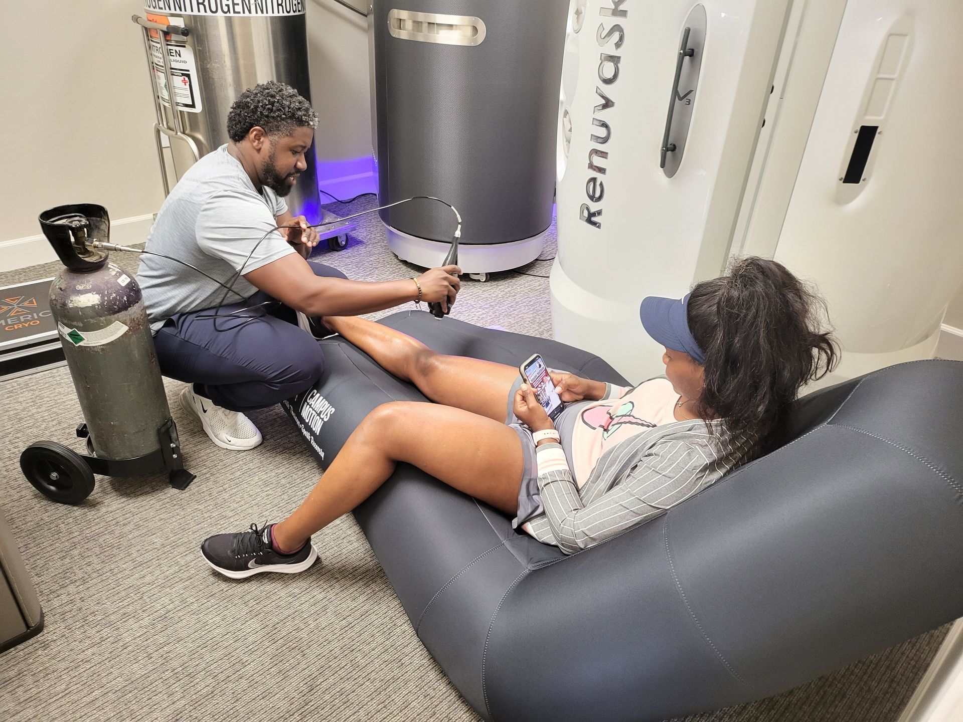 A physical therapist applying local cryotherapy treatment to a patient's specific area of concern during a therapy session.