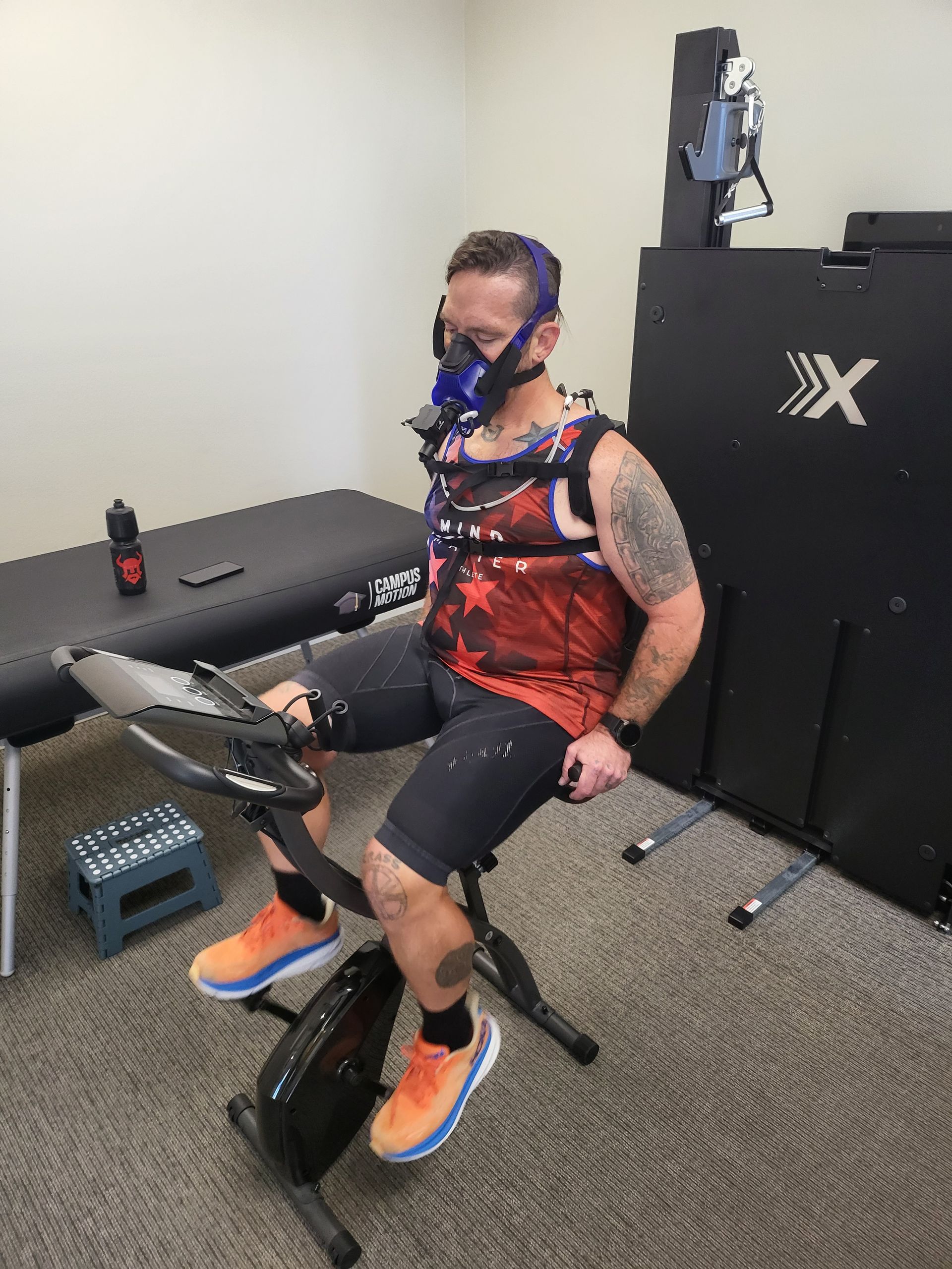 A man on an elliptical machine, about to be tested for RMR, showcasing how RMR Testing contributes to Improved Overall Health by providing valuable insights into metabolic health, enabling early detection and intervention to promote well-being and prevent potential metabolic issues.