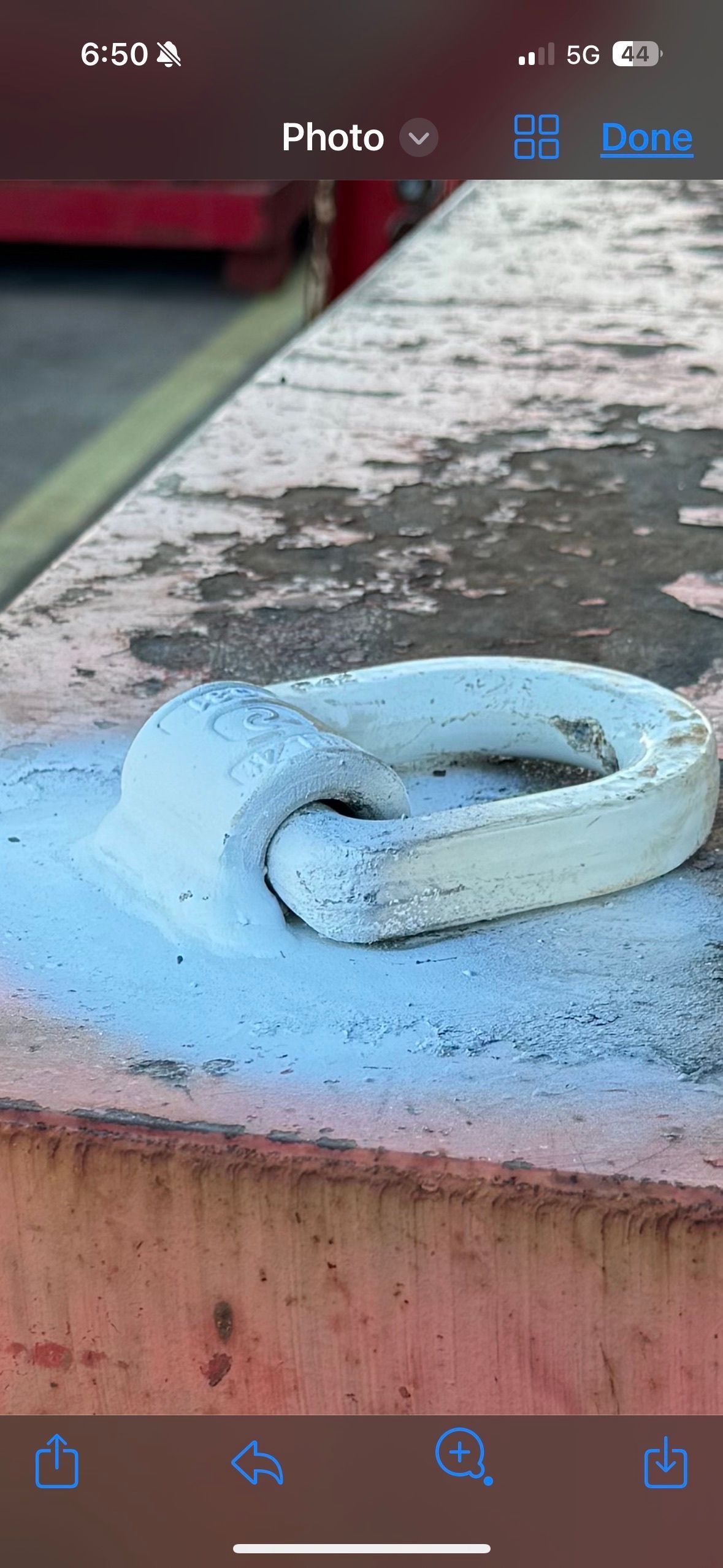 Blue rope coiled on a weathered concrete ledge outdoors — Resurge Diesel & Fabrication Pty Ltd In Balnagowan, QLD
