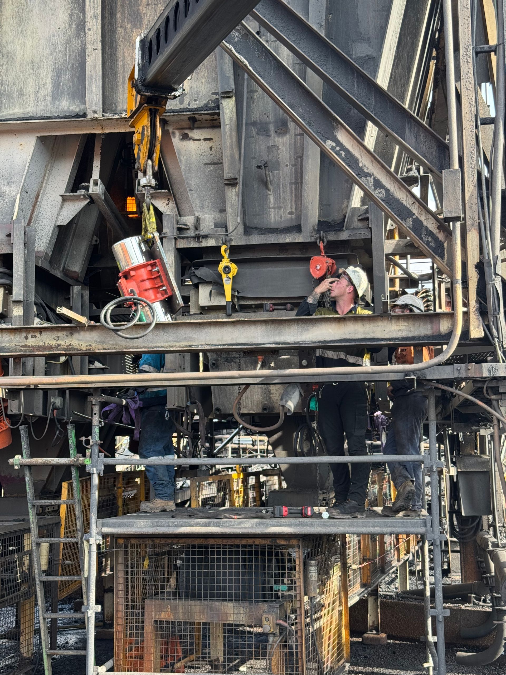 Charred industrial machinery and pipes with orange flames inside a damaged metal structure — Resurge Diesel & Fabrication Pty Ltd In Balnagowan, QLD