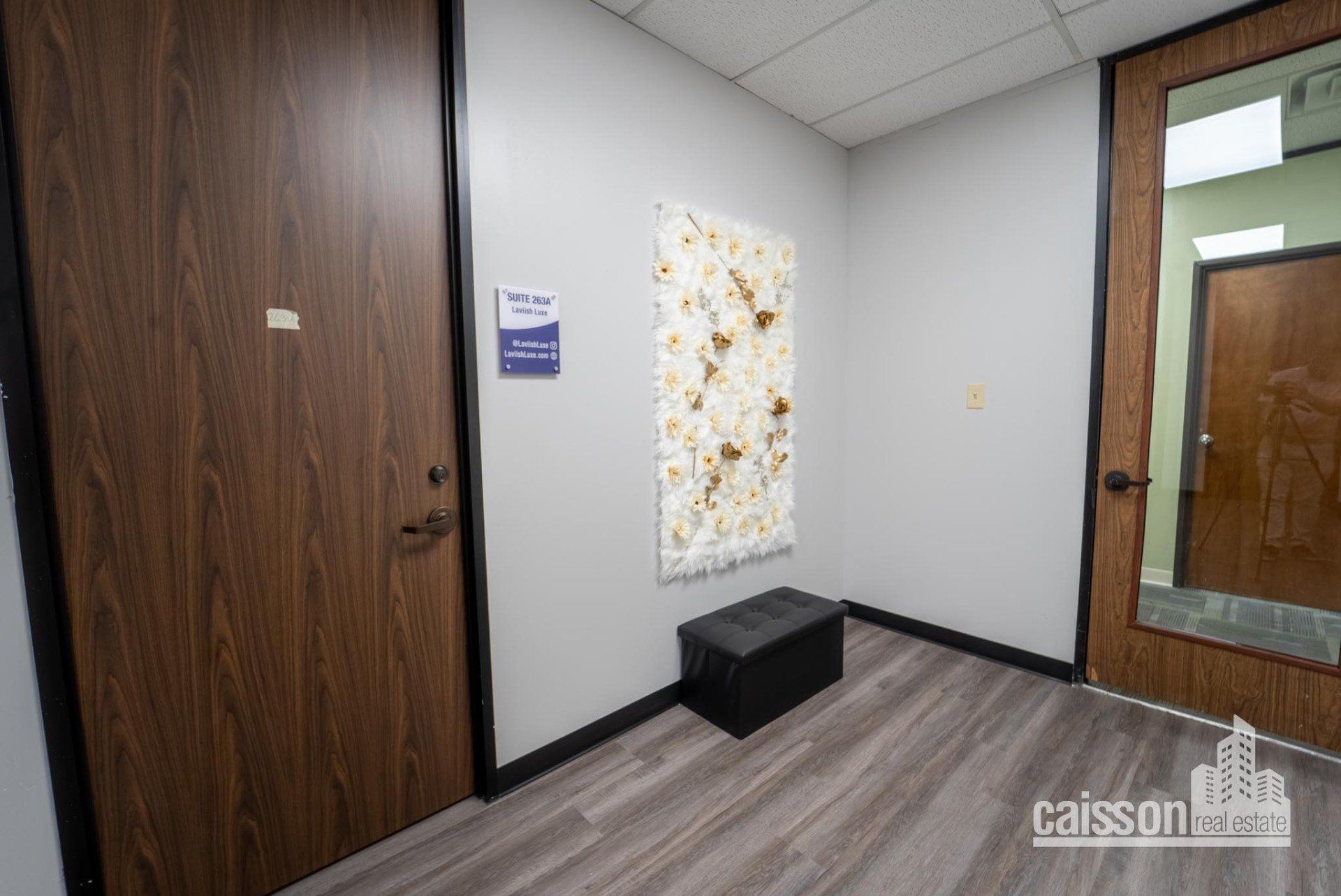 Interior view of lobby in suite with grey flooring.