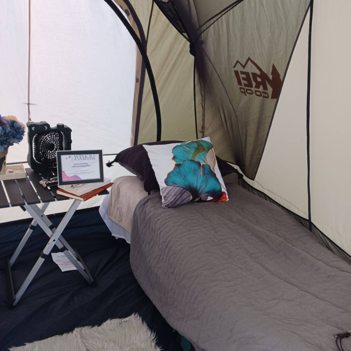 A tent with rei written on the side of it