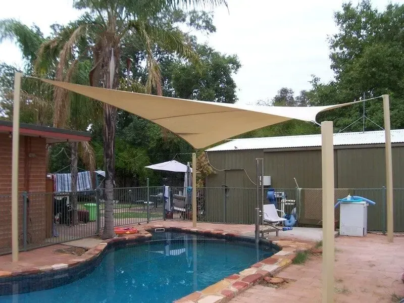 A Shade Sail over A Pool With A Gate In Front — Shadetech in Alice in Ciccone, NT