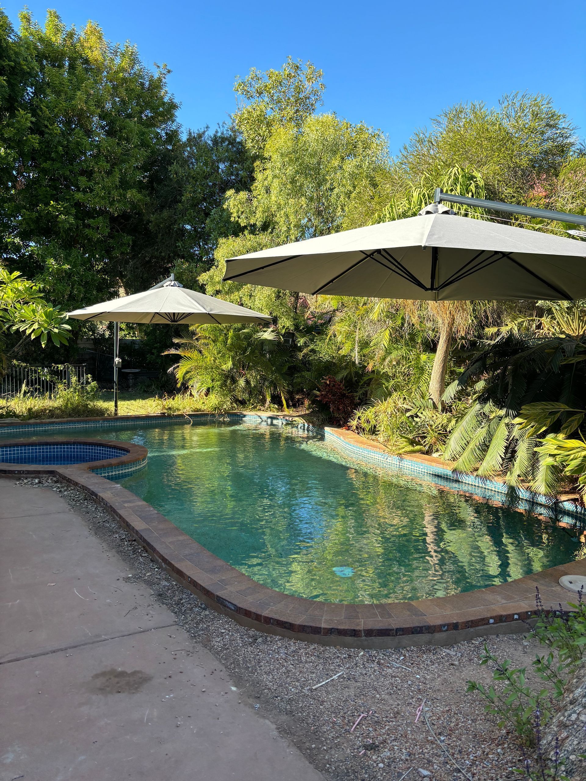 Two Umbrellas Over A Swimming Pool— Shadetech in Alice in Ciccone, NT