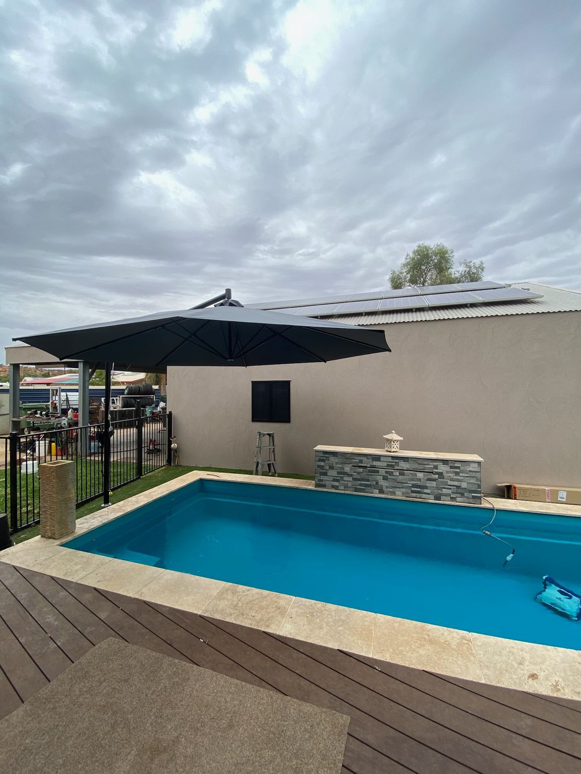 Black Umbrella Over A Pool  — Shadetech in Alice in Ciccone, NT