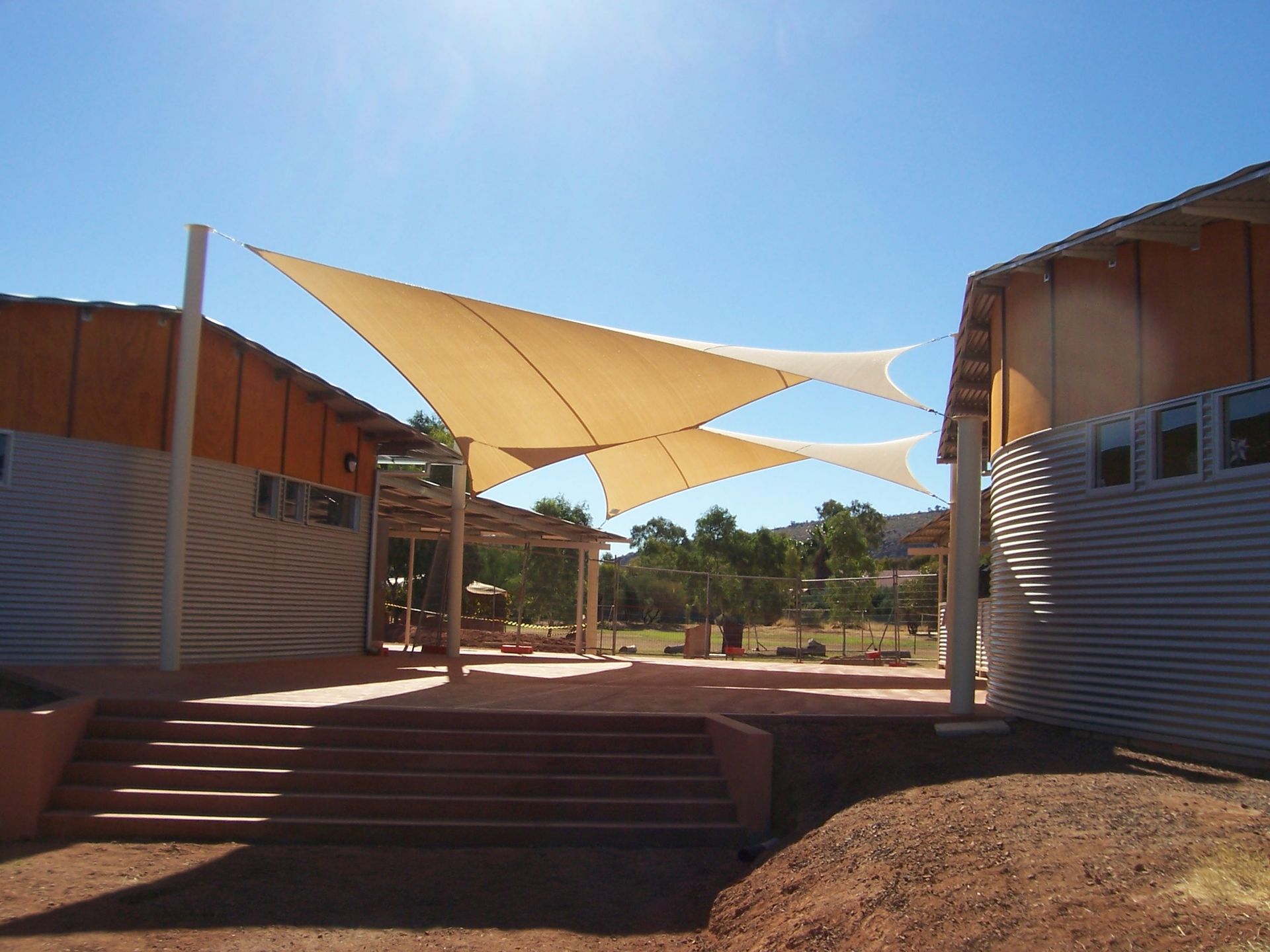 Two Shade Sails With Blue Sky — Shadetech in Alice in Ciccone, NT