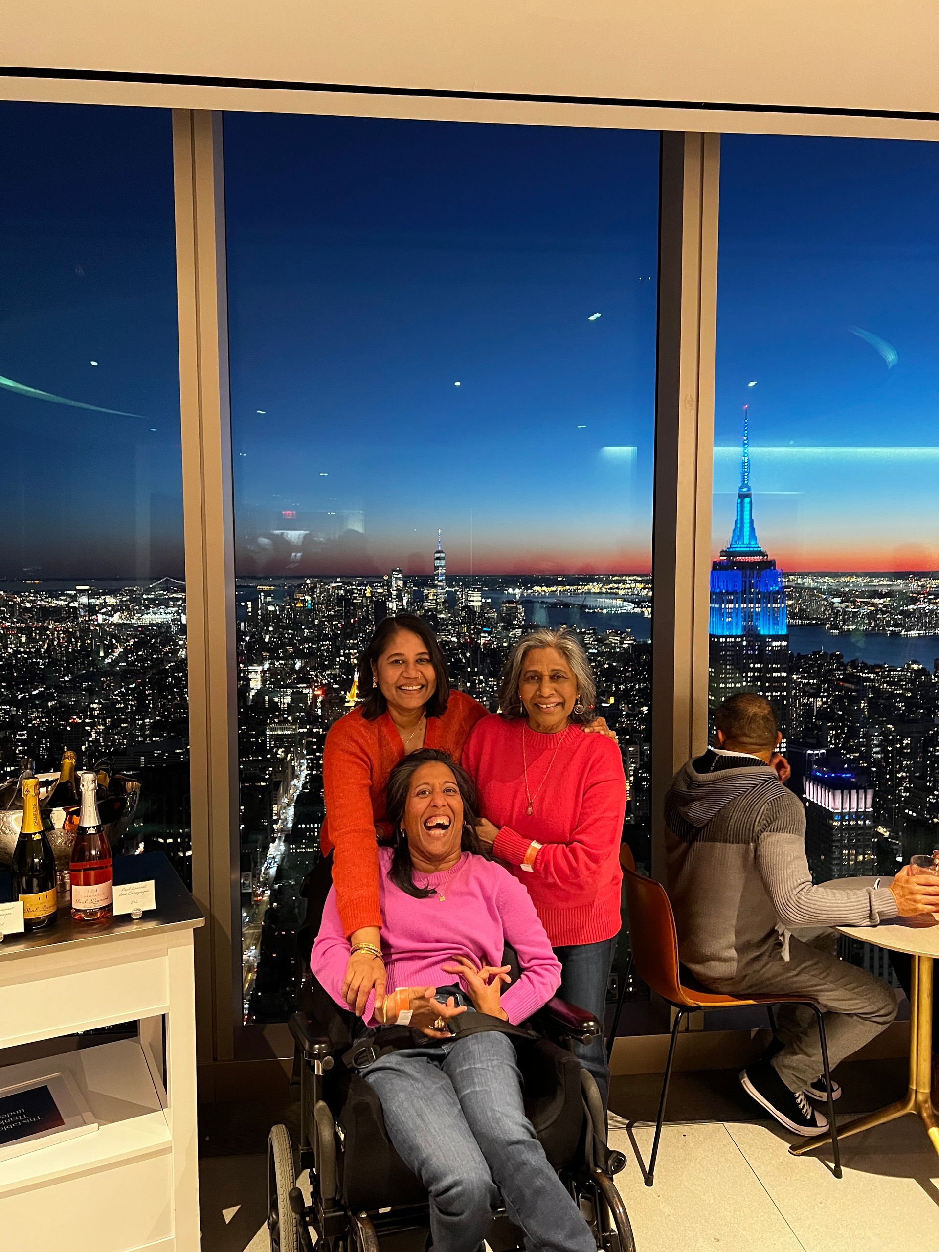 Pure joy on our faces as we smile for this photo with Annie, mom and me. It's night &  NYC look as beautiful as ever lit up. 