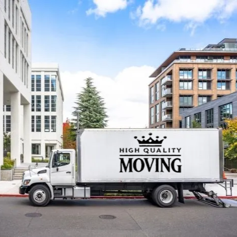 Moving truck parked on a city street, with the words 