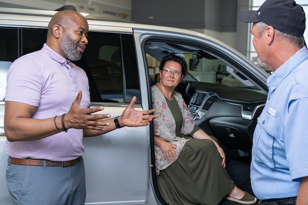 A Russell Sales Associate speaks with clients