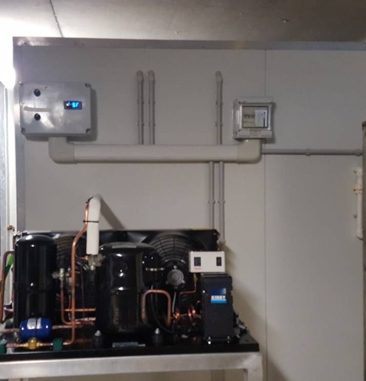 Refrigeration unit with gauges and controls on a white wall.— Cool Tropics Air Conditioning & Refrigeration in Mourilyan Harbour, QLD